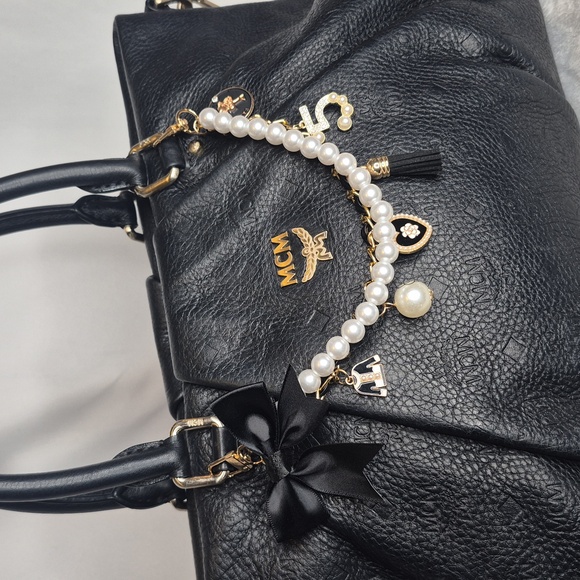 MCM Black Leather Handbag with Gold Accents - Picture 5 of 17